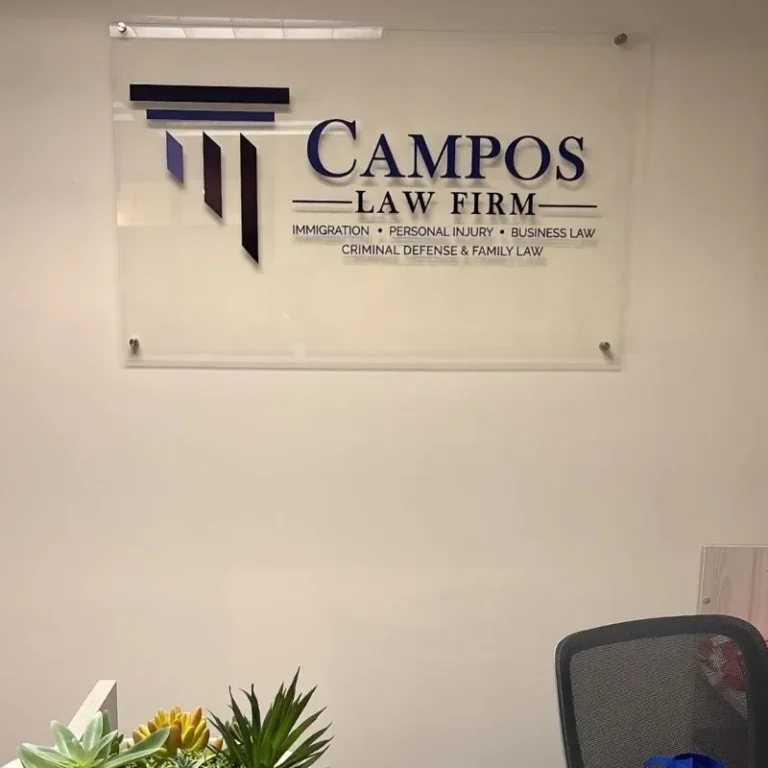 Campos Law Firm Aurora, CO office — reception wall with the firm logo