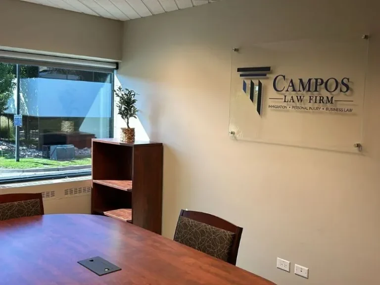 Campos Law Firm Greenwood Village, CO office — conference room with the firm logo
