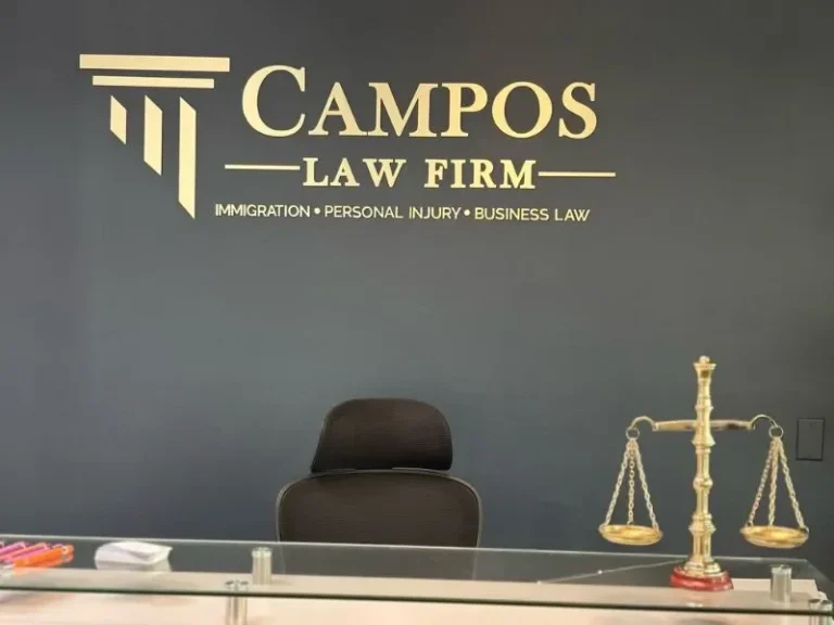 Campos Law Firm Miami, FL office — reception wall with the firm logo
